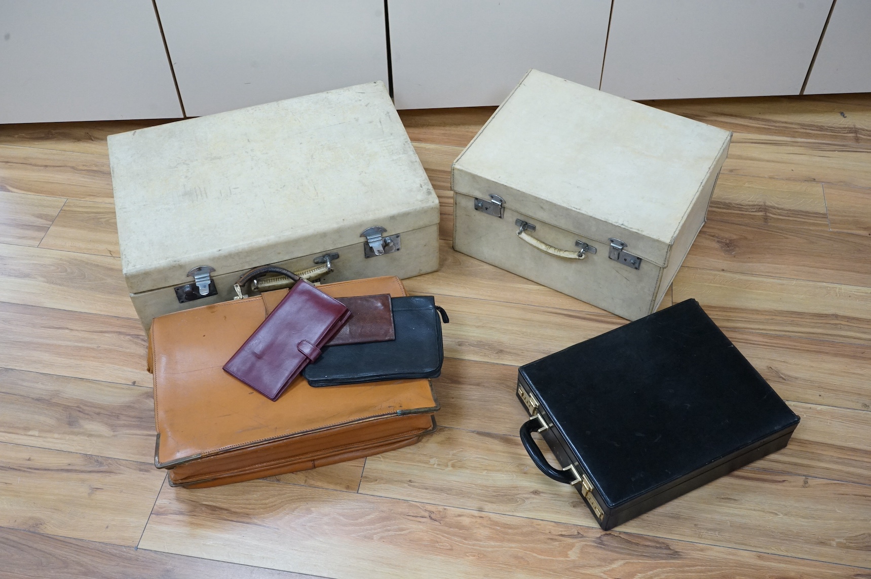 Two calf-skin vellum cases, one with watered silk lining and others. Condition - fair